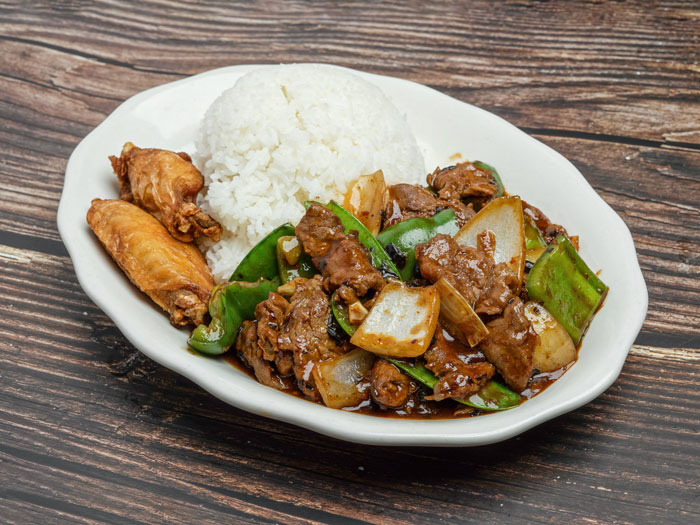 Beef dish with onions and peppers.